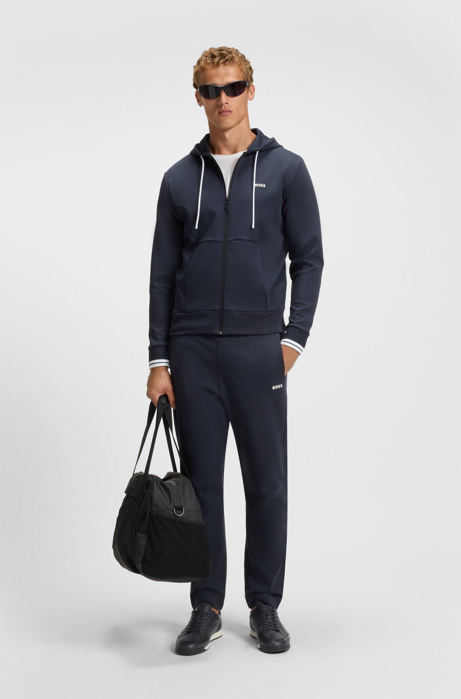 Embossed-logo trainers in leather